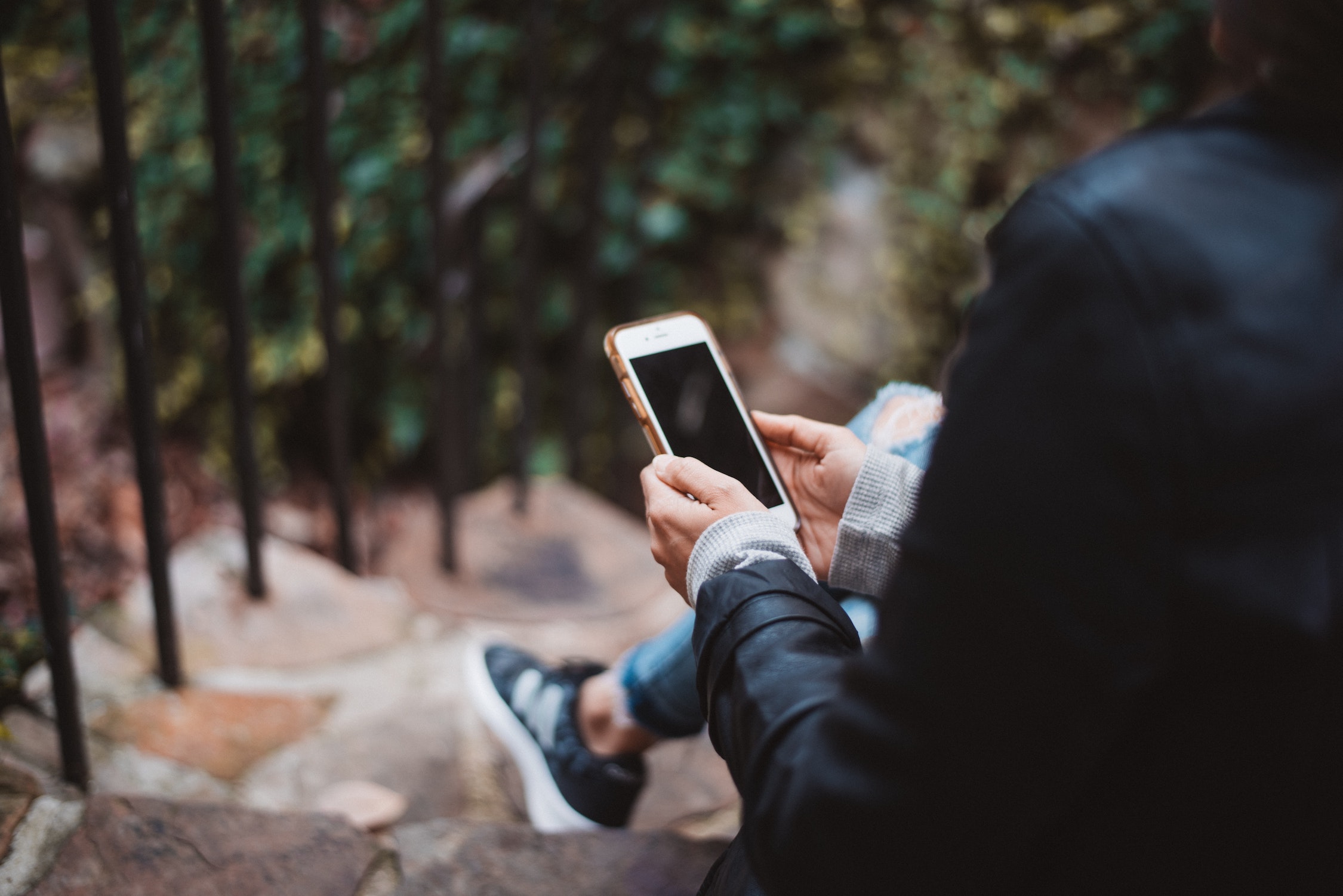 person on phone, photo by Chad Madden, Unsplash.com